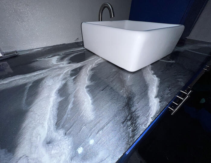 Kitchen countertop with silver and white epoxy design. Kitchen countertop with silver and white epoxy design done in Cement, Oklahoma.