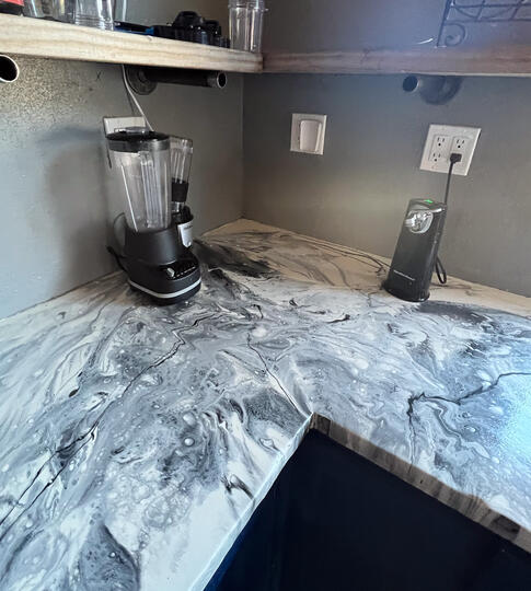 Silver, black, and white epoxy kitchen countertops. Silver, black, and white epoxy kitchen countertops done in Cement, Oklahoma.