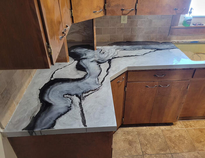 Marbled black and white kitchen countertops done in Cement, Oklahoma.